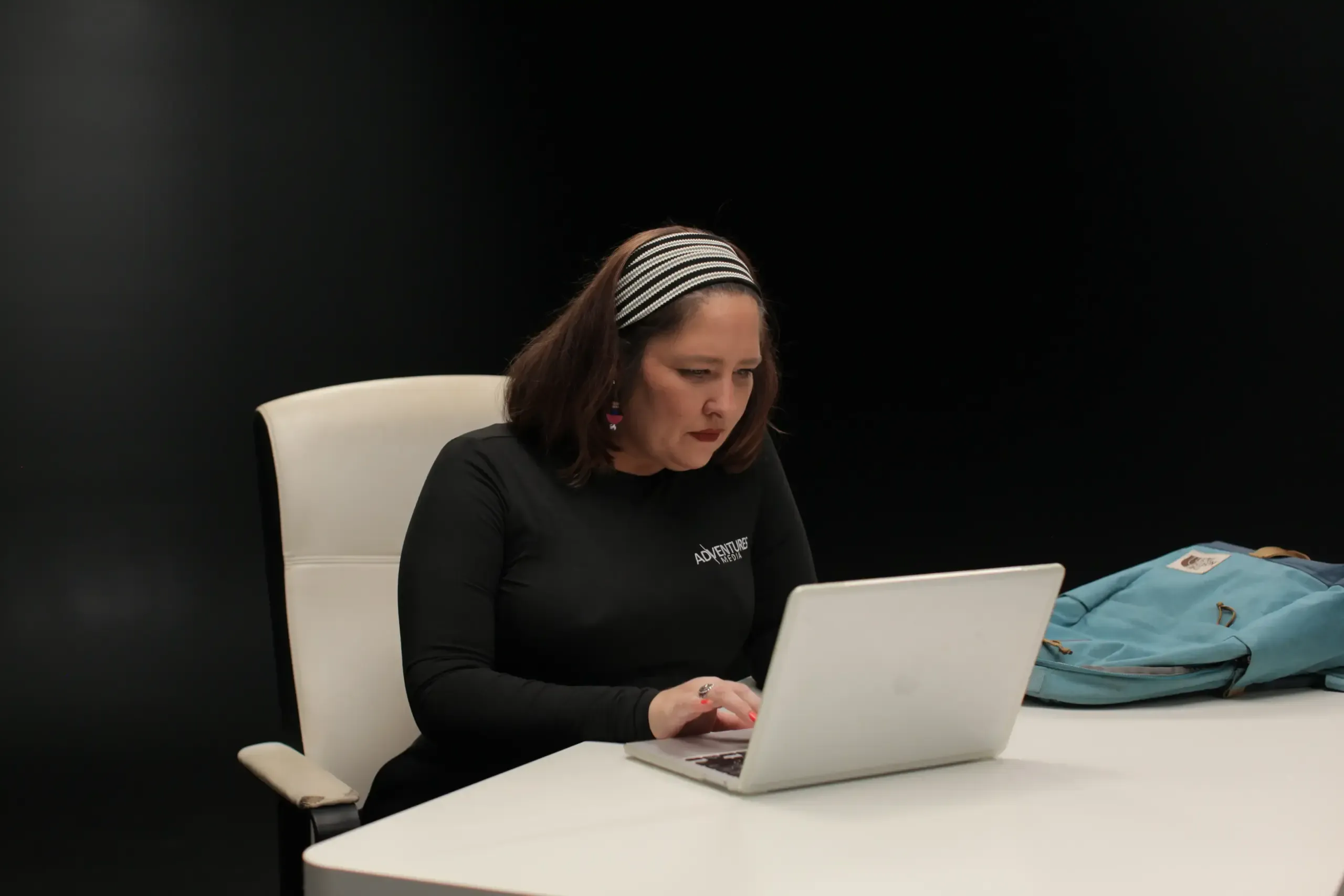 Employee doing competitive research on her laptop.