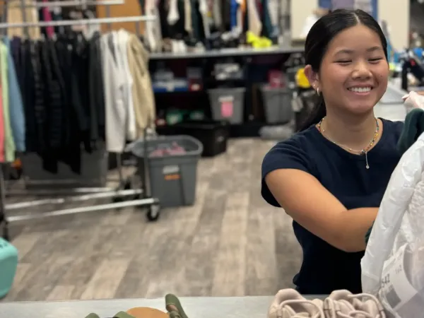 Woman working at a retail shop.