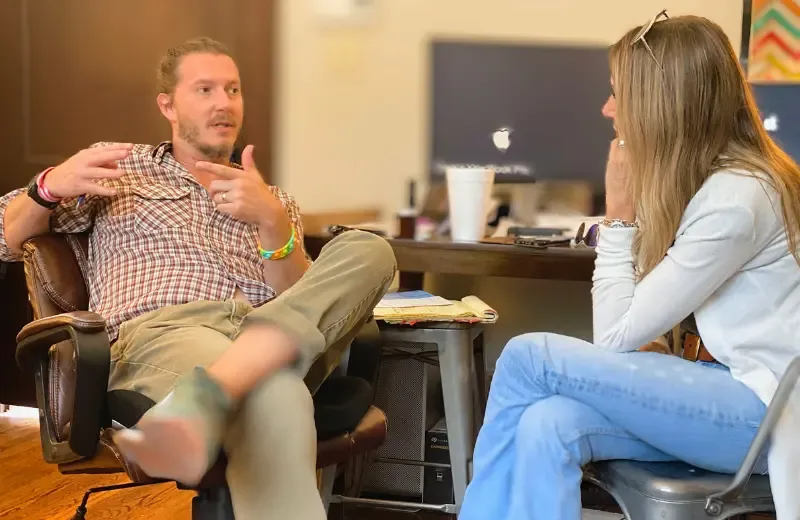 Amy and Mark talking strategy.